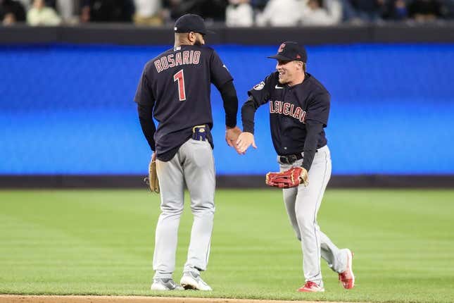 May 1, 2023; Bronx, New York, USA;  Cleveland Guardians shortstop Amed Rosario (1) and center fielder Myles Straw (7) celebrate after defeating the New York Yankees 3-2 at Yankee Stadium.