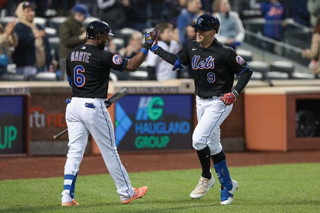 May 5, 2023; New York City, New York, USA; New York Mets center fielder Brandon Nimmo (9) celebrates his solo home run with right fielder Starling Marte (6) during the fourth inning against Colorado Rockies at Citi Field.