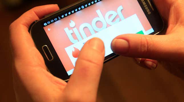 A photo of a person using the Tinder app on a Samsung smartphone.