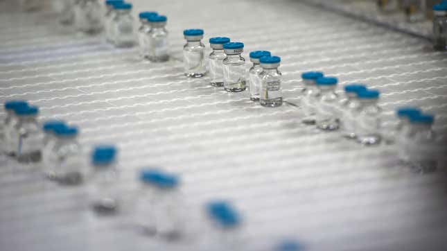 This picture taken on April 22, 2021, in Poce-sur-Cisse, France, shows bottles of diluent on the production line inside the pharmaceutical plant Fareva, which were planned to be used for the CureVac vaccine. 