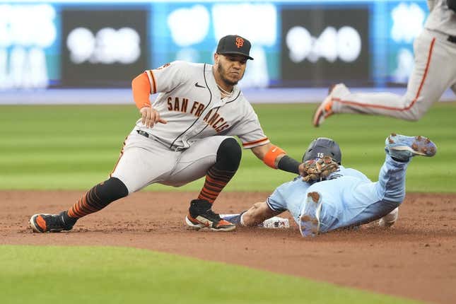 Jun 27, 2023; Toronto, Ontario, CAN; San Francisco Giants second baseman Thairo Estrada (39) catches Toronto Blue Jays left fielder Whit Merrifield (15) trying to steal second base during the second inning at Rogers Centre.