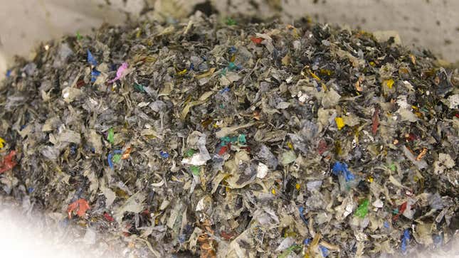 A photo of a bag of shredded plastic from battery recycling. 