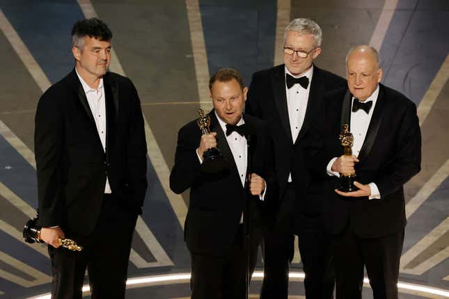 Richard Baneham, Eric Saindon, Daniel Barrett, and Joe Letter accept the Best Visual Effects award for Avatar: The Way Of Water