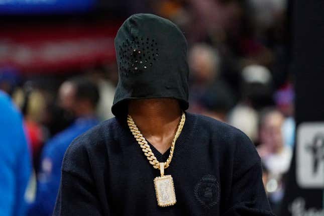 National Football League wide receiver Antonio Brown poses with a hood on at an NBA basketball game between the Los Angeles Clippers and the Golden State Warriors Monday, Feb. 14, 2022, in Los Angeles.