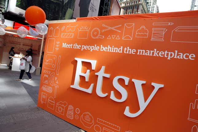 An orange and white sign advertising the online seller Etsy Inc., with a slogan reading "Meet the people behind the marketplace."