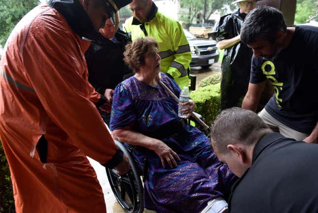 A rescue team evacuates Melanie Clampitt in Bellaire, Texas on Aug. 28