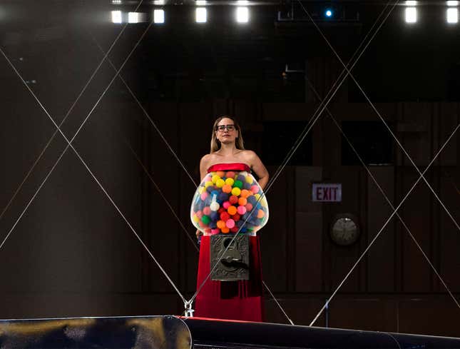 Image for article titled Kyrsten Sinema Descends To Senate Floor On Floating Platform Wearing Dress Shaped Like Gumball Machine