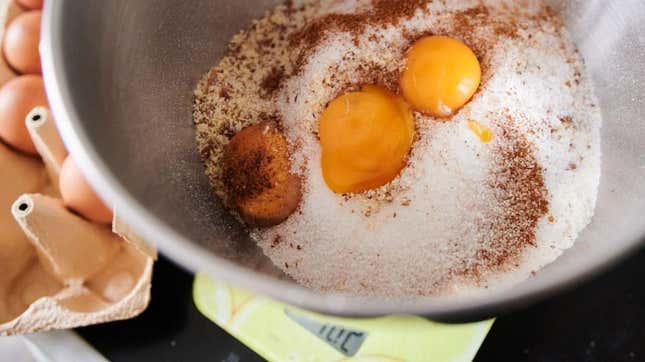 Mixing bowl full of egg yolks and other baking ingredients