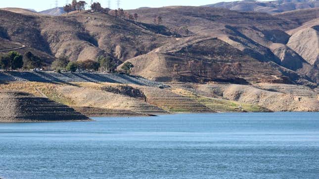 People fish along the Castaic Lake reservoir in Los Angeles County, on October 4, 2022 in Castaic, California. The reservoir, part of the State Water Project, is currently at 35 percent capacity, below the historic average of 43 percent. 