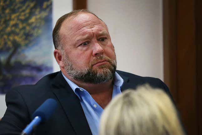 In this Aug 3, 2022 file photo, conspiracy theorist Alex Jones attempts to answer questions about his emails during trial at the Travis County Courthouse in Austin. An attorney representing two parents who sued Jones over his false claims about the Sandy Hook massacre says the U.S. House Jan. 6 committee has requested two years’ worth of records from Jones’ phone. Attorney Mark Bankston said in court Thursday, Aug. 4, 2022 that the committee investigating the attack on the U.S. Capitol has requested the digital records.