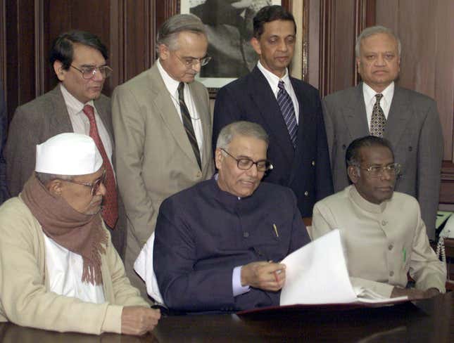 Yashwant Sinha giving his budget the final touches in his office, surrounded by his staff, on Feb.27, 2002.
