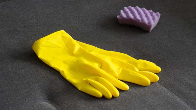 Yellow rubber gloves laying on couch