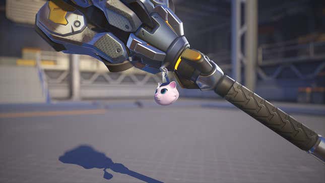 A kitten charm hangs off a weapon.