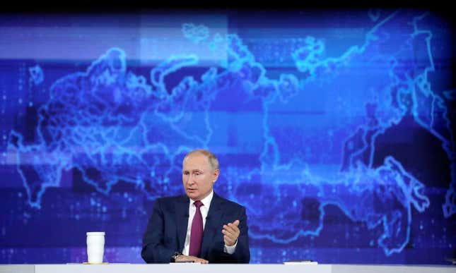 Russian president Vladimir Putin sitting in front of a large blue map of the Europe and Asia. Hackers working on behalf of Putin are escalating their attacks on Ukraine, according to new research presented at the Black Hat conference. 