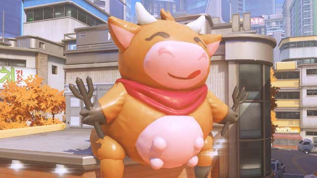The cow balloon is seen perched up on the roof of a building in the Overwatch 2 Busan map.
