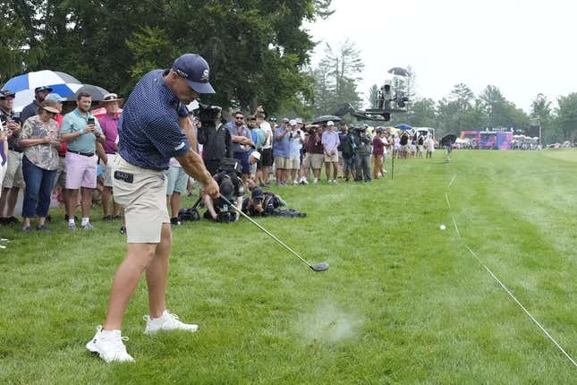 Aug 6, 2023; White Sulphur Springs, West Virginia, USA; Bryson DeChambeau hits his approach shot from the rough on 17 during the final round of the LIV Golf event at The Old White Course.