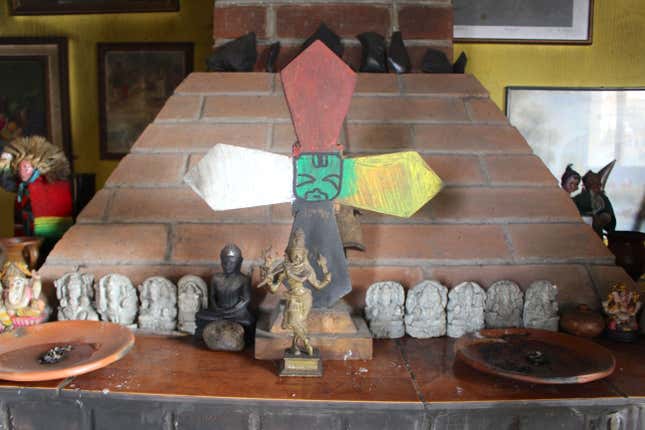Simeon Taquira carries out at-home spiritual ceremonies. The Mayan cross is the center of the healing process.