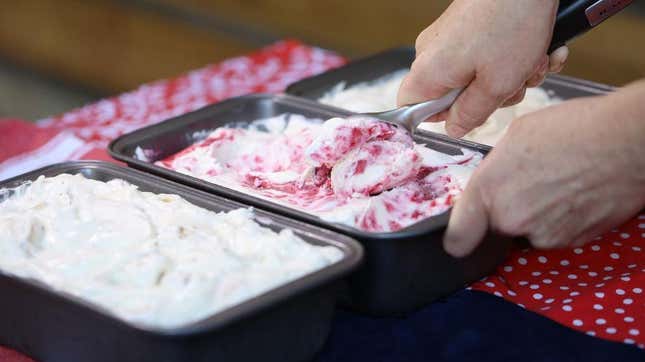 Hand scooping from a pan of no-churn ice cream