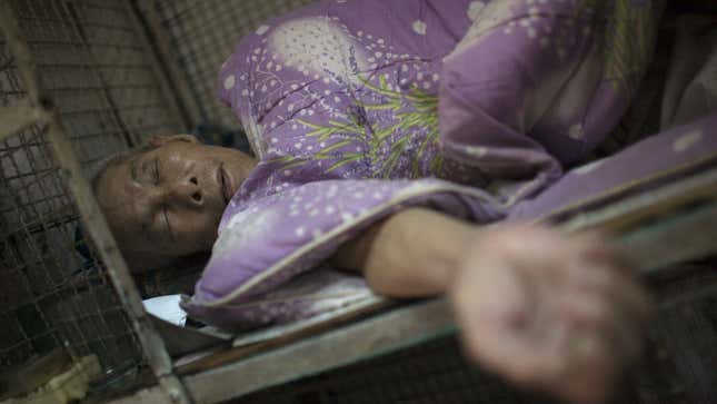 “Cubicle”: Tai Lun-po sleeps in a small cage in Tai Kok Tsui district July 16, 2008. In older districts like Tai Kok Tsui, hundreds of elderly men still reside in caged cubicles in cramped, old tenement flats which house up to 12 individuals in often squalid conditions.