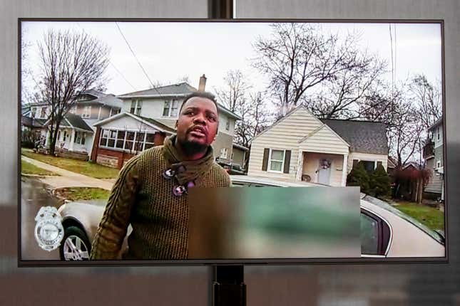 A TV display shows video evidence of a Grand Rapids police officer struggling with and shooting Patrick Lyoya at Grand Rapids City Hall on Wednesday, April 13, 2022.