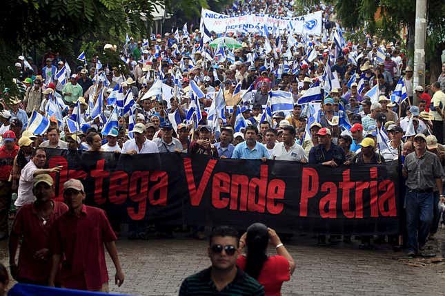 Protesters in Juigalpa City, Nicaragua hold a banner that reads: "Ortega you sell our country."
