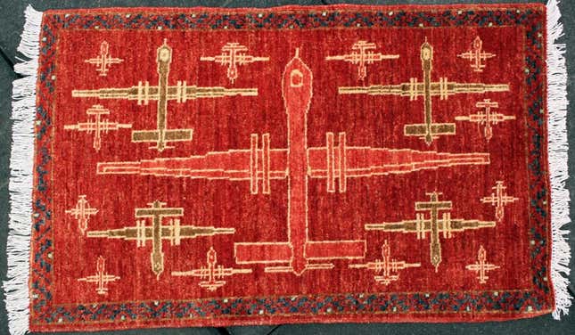 Image for article titled Afghan carpet weavers are putting drones on their rugs