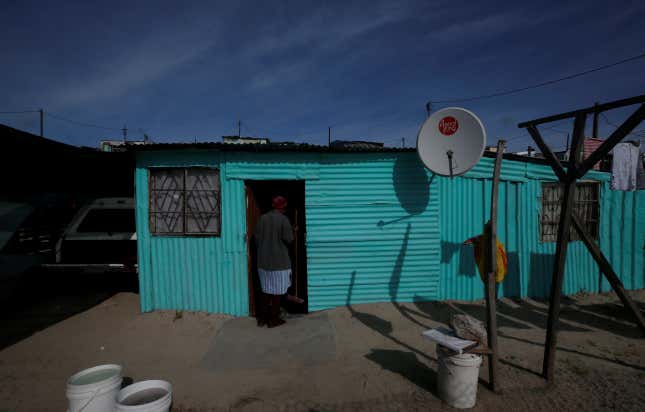 A satellite dish connects residents to South Africa’s DSTV television network, owned by telecommunications giant Naspers, in Khayelitsha township, Cape Town.