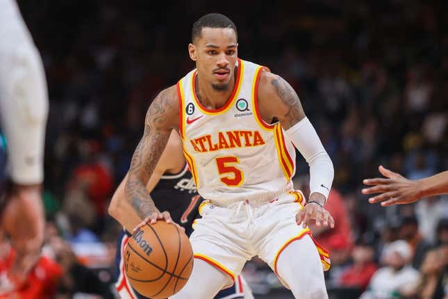 Apr 5, 2023; Atlanta, Georgia, USA; Atlanta Hawks guard Dejounte Murray (5) dribbles against the Washington Wizards in the first half at State Farm Arena.