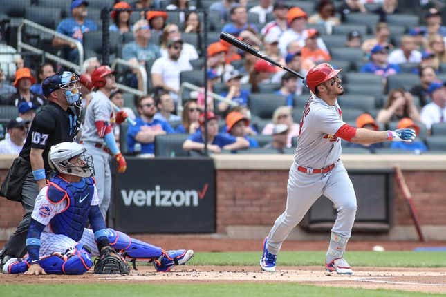 Jun 18, 2023; New York City, New York, USA;  St. Louis Cardinals third baseman Nolan Arenado (28) hits a two run home run in the first inning against the New York Mets at Citi Field.