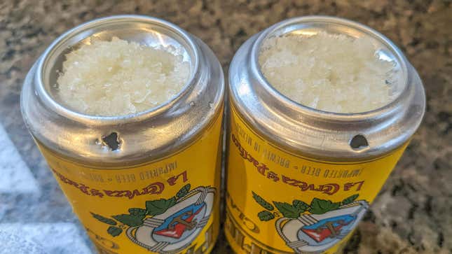 Cerveja Na Bundinha (two inverted beer cans with salt and lime juice served on top)