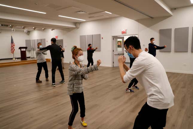 Members of the Public Safety Patrol, a volunteer anti-hate crime group, take part in a self-defense class at the Flushing neighborhood of Queens on April 25, 2021 in New York.