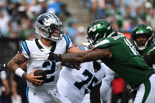 Aug 12, 2023; Charlotte, North Carolina, USA;  Carolina Panthers quarterback Matt Corral (2) is sacked by New York Jets linebacker Jermaine Johnson (11) in the second quarter at Bank of America Stadium.