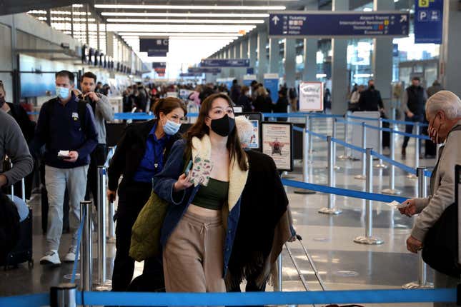 People go through TSA screening as they catch flights at O’Hare International Airport on March 11, 2022, in Chicago, Illinois. 