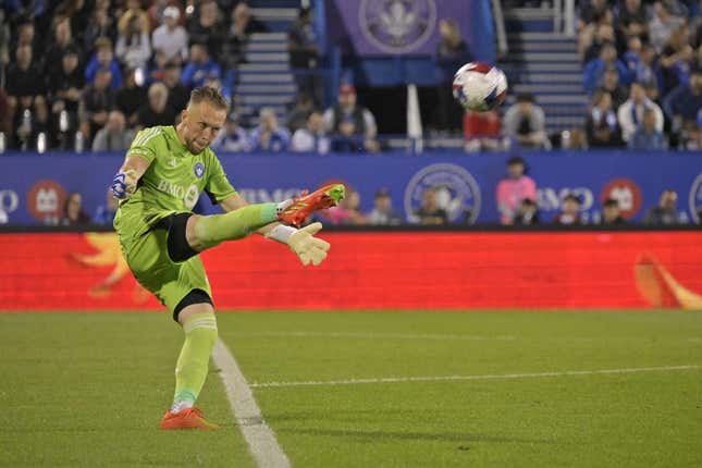 Aug 26, 2023; Montreal, Quebec, CAN; CF Montreal goalkeeper Jonathan Sirois (40) punts the ball against the New England Revolution during the second half at Stade Saputo.