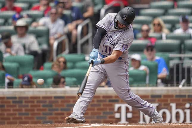 June 18, 2023;  Cumberland, Georgia, USA;  Colorado Rockies first baseman Mike Moustakas (11) singles against the Atlanta Braves during the second inning at Truist Park.