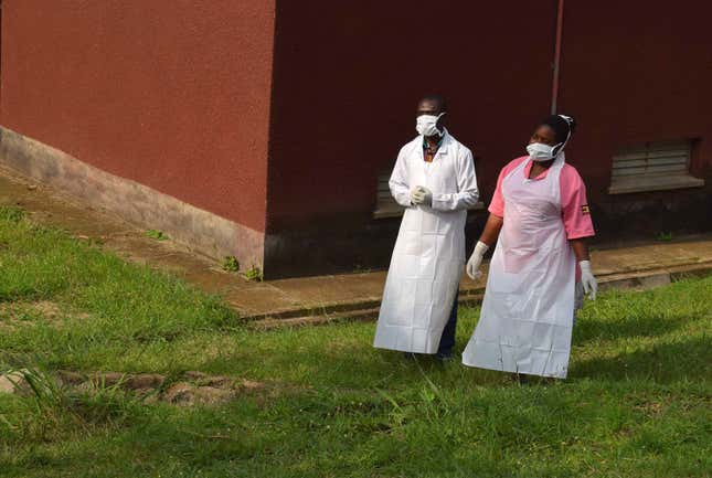 Ugandan medical staff inspect the Ebola preparedness facilities at the Bwera general hospital near the border DR Congo