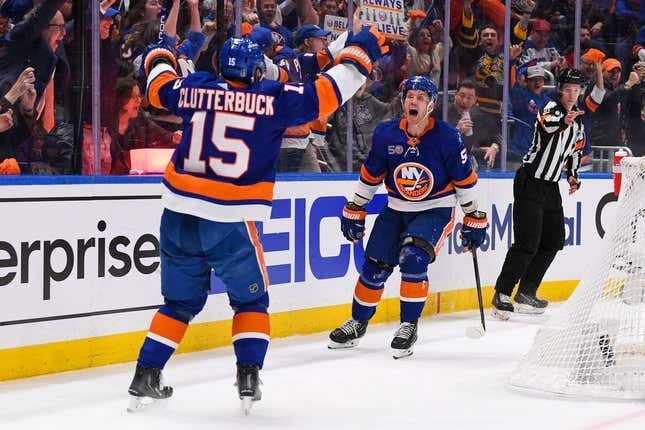 Apr 21, 2023; Elmont, New York, USA; New York Islanders center Casey Cizikas (53) celebrates his goal with right wing Cal Clutterbuck (15) against the Carolina Hurricanes during the second period in game three of the first round of the 2023 Stanley Cup Playoffs at UBS Arena.