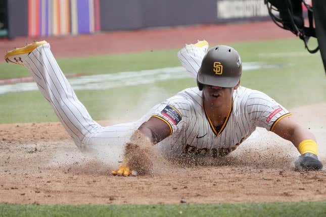 Apr 30, 2023; Mexico City, Mexico; San Diego Padres left fielder Juan Soto (22) slides into home plate to score in the eighth inning after the game during a MLB World Tour game at Estadio Alfredo Harp Helu.