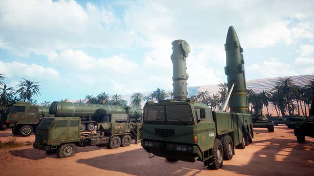 Some Iron Conflict trucks are chilling in a dirt lot with missiles seemingly ready for launch.