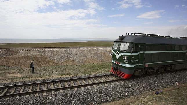 Freight train on tracks in barren landscape
