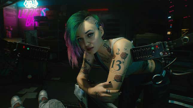 Cyberpunk 2077's Judy leans over her ripper equipment before operating. 