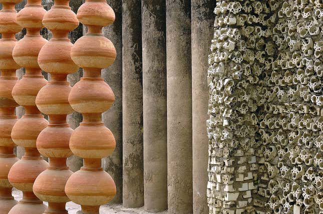 Pots, pillars and electric bulb sockets at the Nek Chand Rock Garden in Chandigarh, India.
