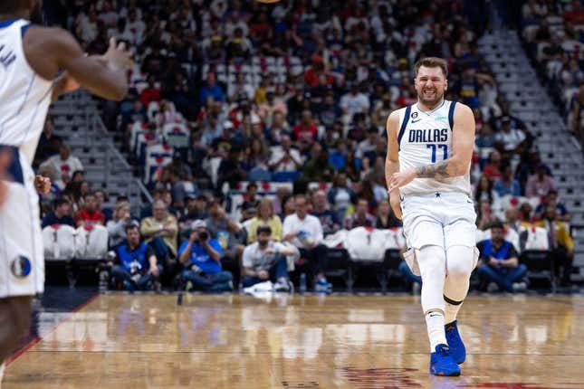 Mar 8, 2023; New Orleans, Louisiana, USA; Dallas Mavericks guard Luka Doncic (77) reacts as he passes the ball to forward Tim Hardaway Jr. (11) against the New Orleans Pelicans during the first half at Smoothie King Center.