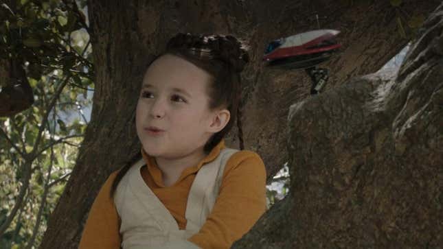 Leia in a tree with her droid.