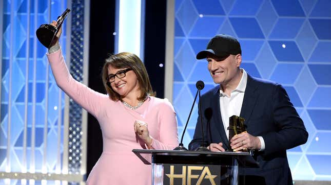 Victoria Alonso and Kevin Feige accepting an award together in 2019