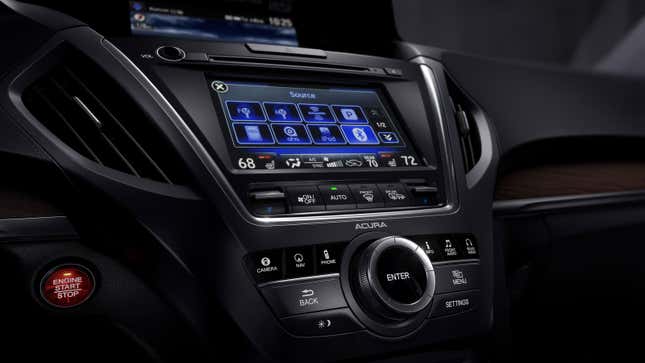A photo of the center console in an Acura car. 