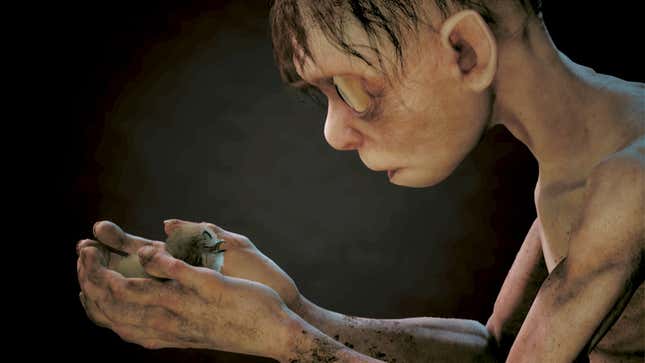 Gollum stares at baby bird in his cupped hands.