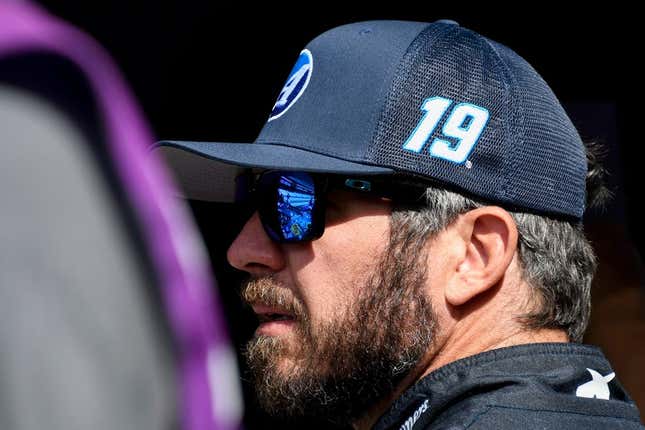 NASCAR Cup Series driver Martin Truex Jr. (19) stands by his car Saturday, Aug. 12, 2023, during practice for the NASCAR Cup Series Verizon 200 at Indianapolis Motor Speedway.