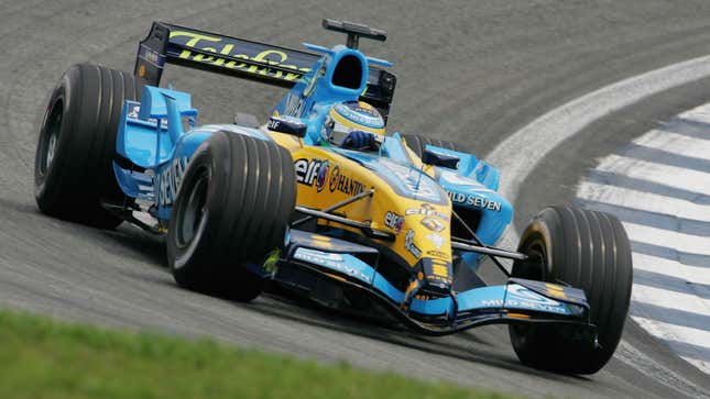 A photo of a blue and yellow Lotus Formula 1 car. 