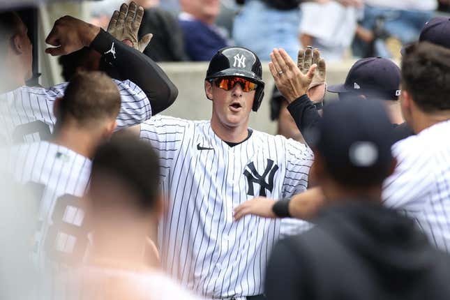 Apr 16, 2023; Bronx, New York, USA;  New York Yankees third baseman DJ LeMahieu (26) is greeted in the dugout after hitting a home run in the sixth inning against the Minnesota Twins at Yankee Stadium.